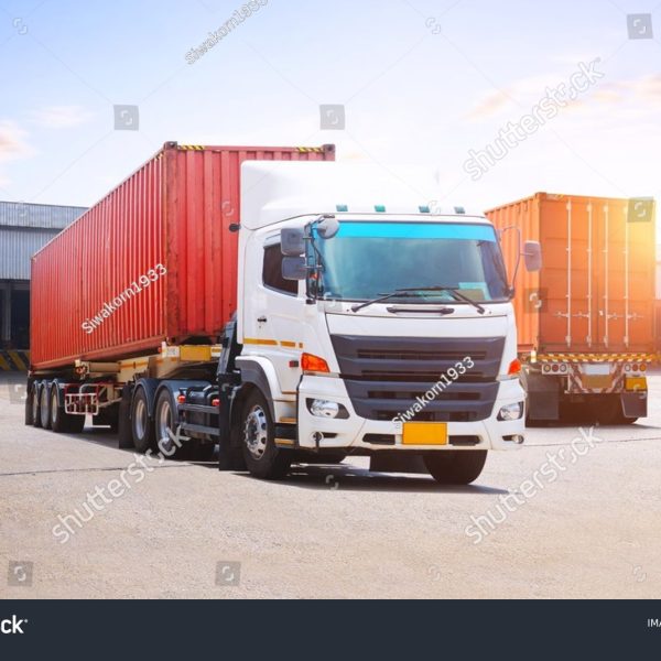 stock-photo-semi-trailer-trucks-on-the-parking-lot-at-warehouse-shipping-cargo-container-trucks-loading-goods-2767283121